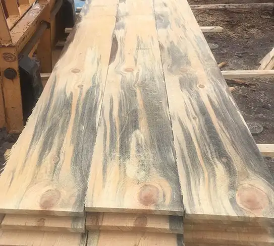 Rough sawn lumber boards stacked